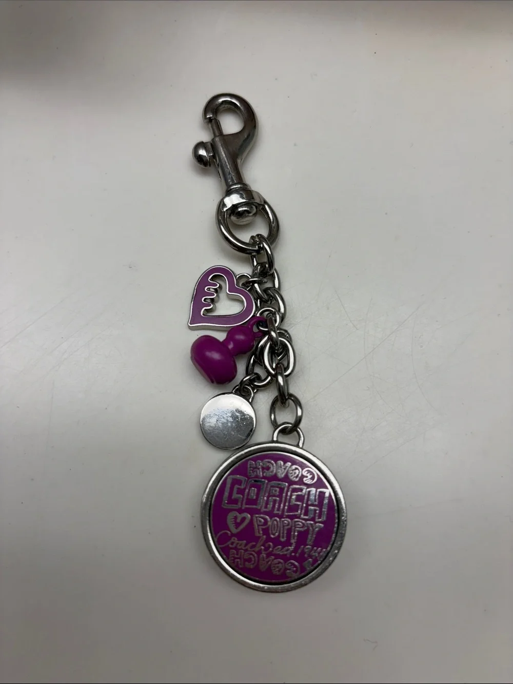 Very rare Coach Silver-Tone Keychain with Bright Purple Accents and lip gloss